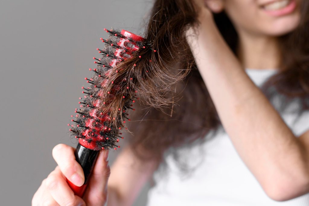 close up female brushin hair 23 2148547382