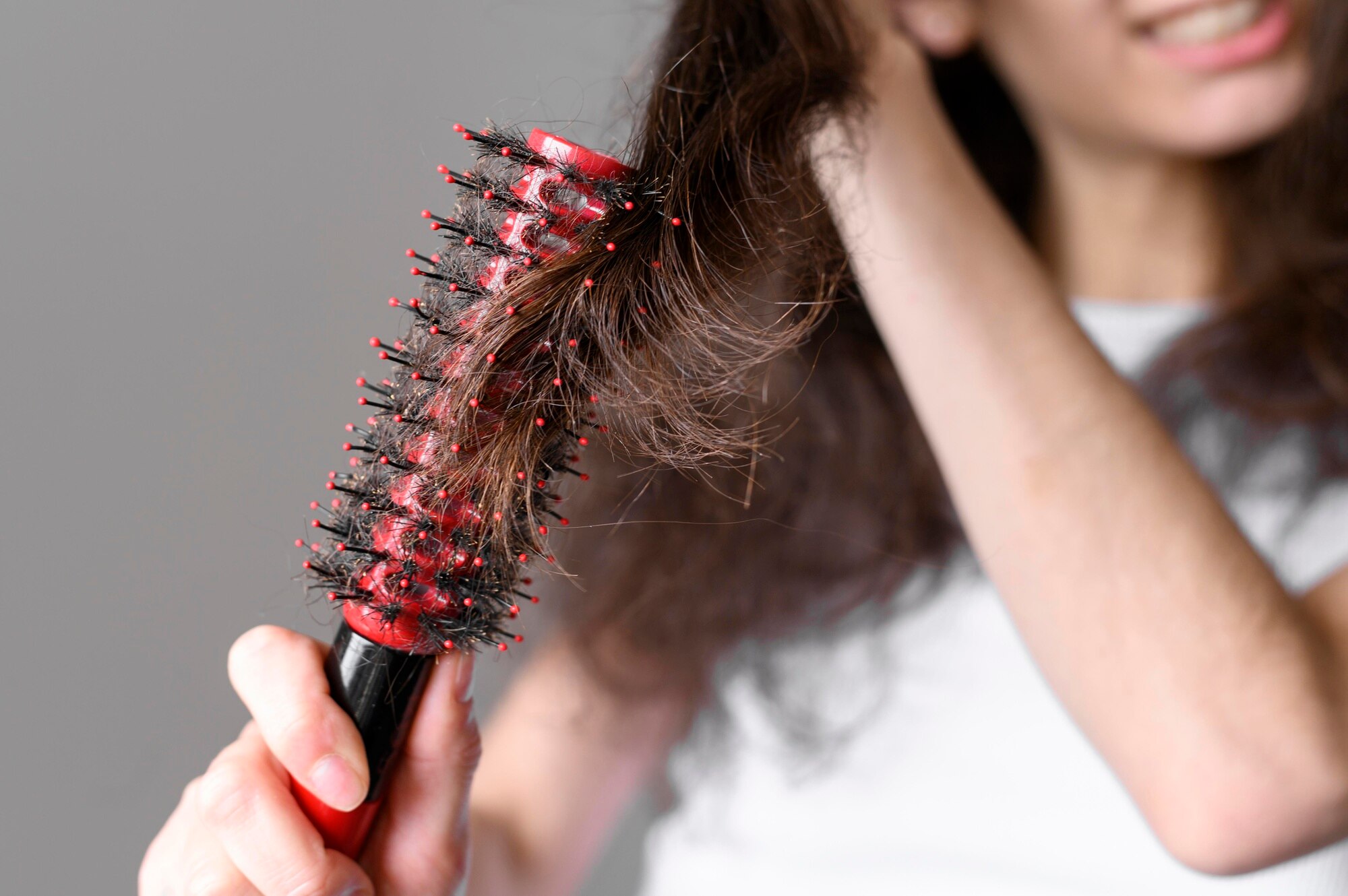 close up female brushin hair 23 2148547382